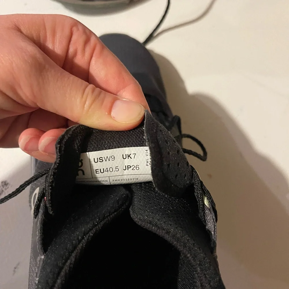 On Running Women’s Athletic Sneakers with Gray Sole and pink and green accents.